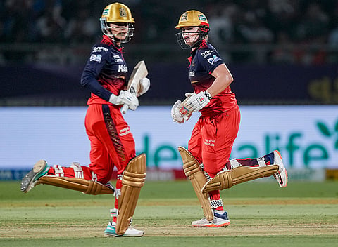 Royal Challengers Bengaluru's captain Smriti Mandhana and teammate Georgia Voll run between the wickets during the Women's Premier League (WPL) 2026 final T20 cricket match between Delhi Capitals and Royal Challengers Bengaluru, at Baroda Cricket Association Stadium, Kotambi in Vadodara, Gujarat.