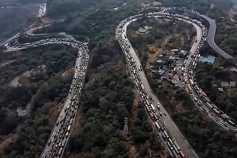 Vehicles stuck in a traffic jam on the Mumbai-Pune Expressway after a gas tanker overturned in the Khandala Ghat section, in Raigad district, Maharashtra.