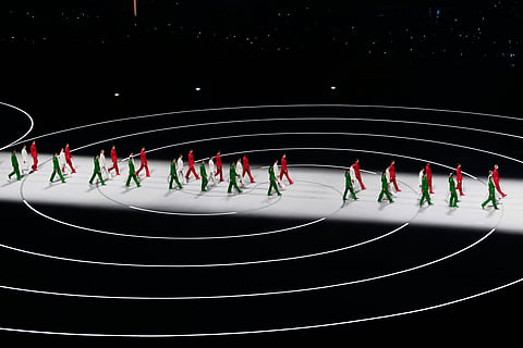 Artists wearing Italian colors perform during the Olympic opening ceremony at the 2026 Winter Olympics, in Milan, Italy, Friday, Feb. 6, 2026. 