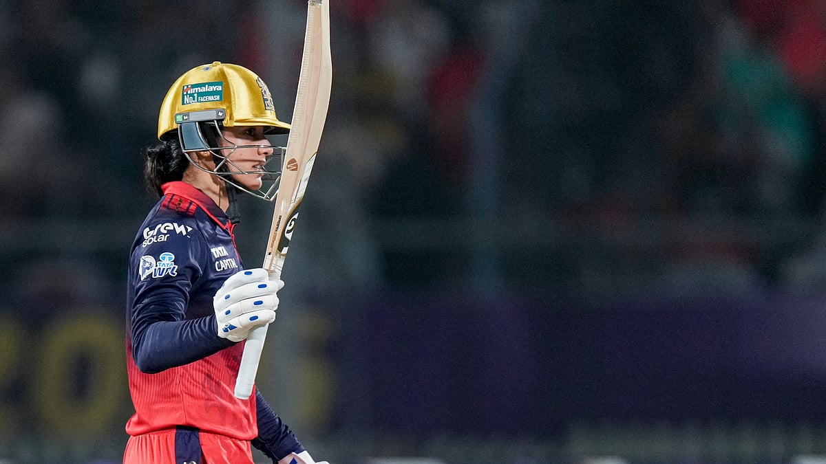 | Photo: PTI/Arun Sharma : Royal Challengers Bengaluru's captain Smriti Mandhana celebrates her half century during the Women's Premier League (WPL) 2026 final T20 cricket match between Delhi Capitals and Royal Challengers Bengaluru, at Baroda Cricket Association Stadium, Kotambi in Vadodara, Gujarat, Thursday, Feb. 5, 2026.