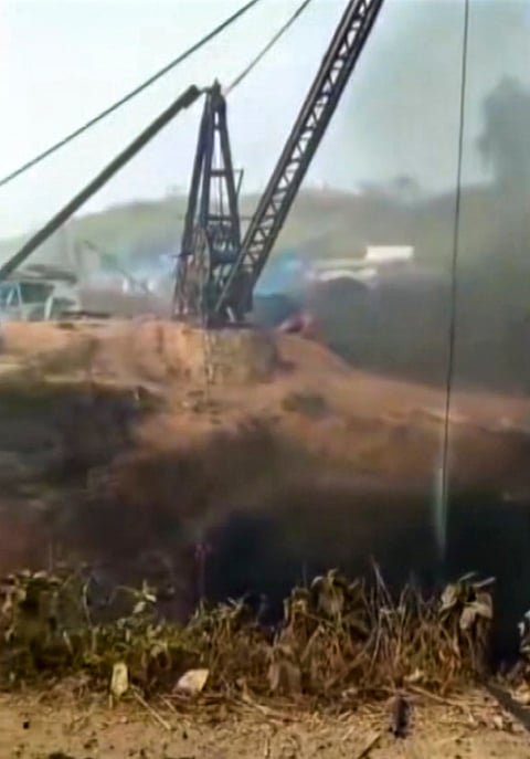 Smoke billows after an explosion at an illegal coal mine, in East Jaintia Hills district, Meghalaya. 
