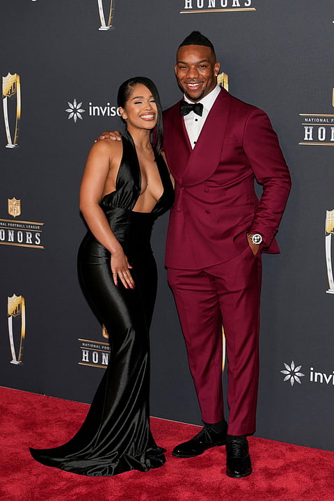 Atlanta Falcons' Bijan Robinson, right, arrives at football's NFL Honors award show in San Francisco.