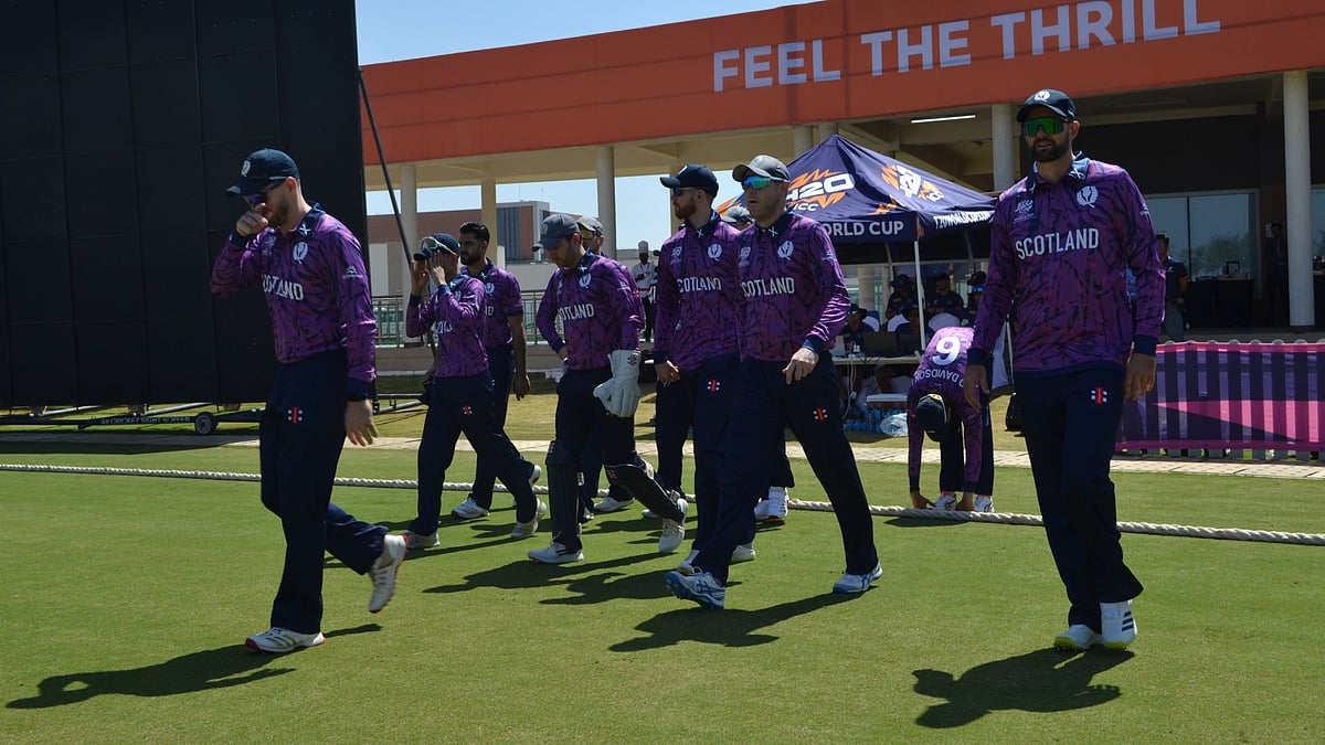 | Photo: X/CricketScotland : Scotland players in action during the ICC T20 World Cup 2026 warm-up match against Namibia on February 4, 2026.