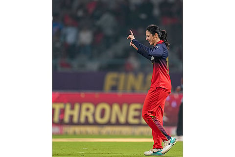 Royal Challengers Bengaluru's captain Smriti Mandhana celebrates after the team won the Women's Premier League (WPL) 2026 final T20 cricket match against Delhi Capitals, at Baroda Cricket Association Stadium, Kotambi in Vadodara, Gujarat.