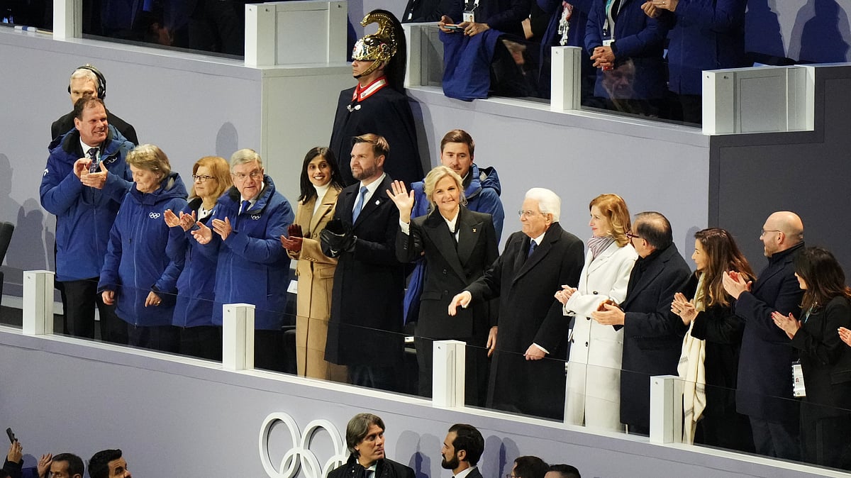 (AP Photo/Stephanie Scarbrough) : IOC President Kirsty Coventry, center, waves as she stands next to former IOC president Thomas Bach, Vice President JD Vance and second lady Usha Vance and Italian President Sergio Mattarella during the Olympic opening ceremony at the 2026 Winter Olympics, in Milan, Italy, Friday, Feb. 6, 2026. 