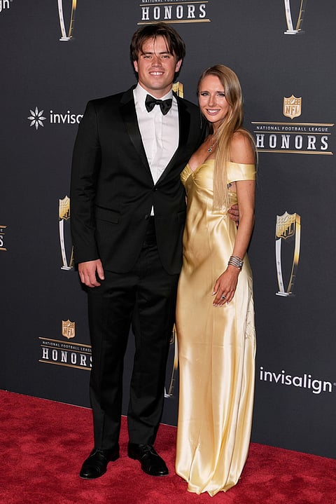 Los Angeles Chargers' Cameron Dicker, left, and Annie Buerk arrive for football's NFL Honors award show in San Francisco.
