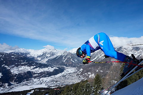 Italy's Giovanni Franzoni starts an alpine ski, men's downhill official training, at the 2026 Winter Olympics, in Bormio, Italy.