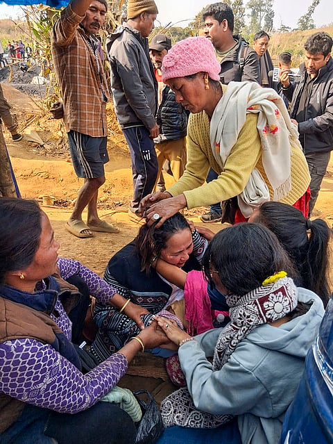 Family members wail amid a search and rescue operation after at least 18 miners were killed and several others were feared trapped following an explosion in an illegal coal mining site, in East Jaintia Hills district, Meghalaya.