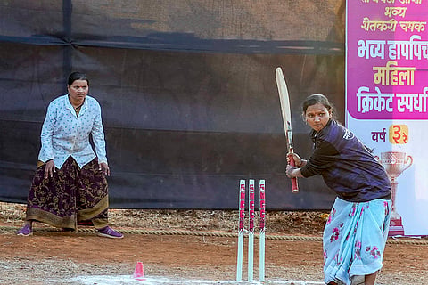 Women farmers participate in a farmers' cricket tournament, organised to mark the end of the farming season, in Pune district, Maharashtra. 