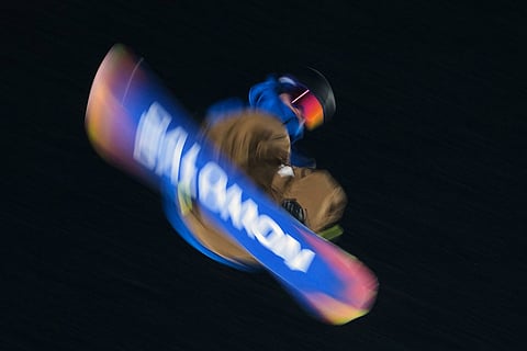 Germany's Noah Vicktor practices during a snowboard big air training session at the 2026 Winter Olympics, in Livigno, Italy.