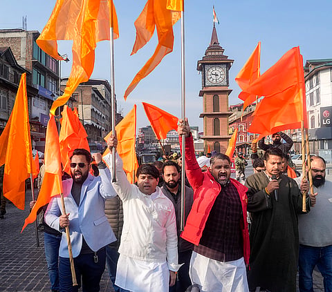 People participate in a cross-country 'Dhwaj Yatra' organised as part of celebrations of 100 years of Rashtriya Swayamsevak Sangh (RSS), in Srinagar. The rally commenced from historic Lal Chowk on Friday, and is scheduled to culminate in Kanyakumari. 