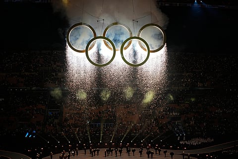 Fireworks explode from the Olympic rings during the Olympic opening ceremony at the 2026 Winter Olympics, in Milan, Italy.