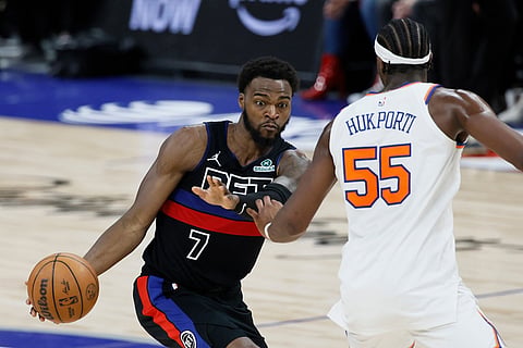 Detroit Pistons forward Paul Reed (7) drives against New York Knicks center Ariel Hukporti (55) during the second half of an NBA basketball game in Detroit. 