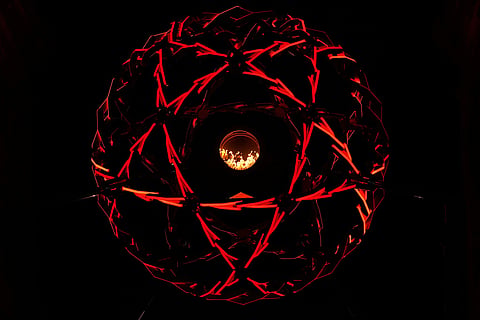A view of the lit cauldron at the Arco della Pace during the Olympic opening ceremony at the 2026 Winter Olympics, in Milan, Italy.