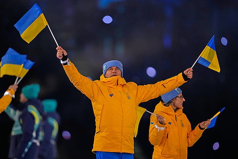 Athletes from Ukraine arrive during the Olympic opening ceremony at the 2026 Winter Olympics, in Milan, Italy.