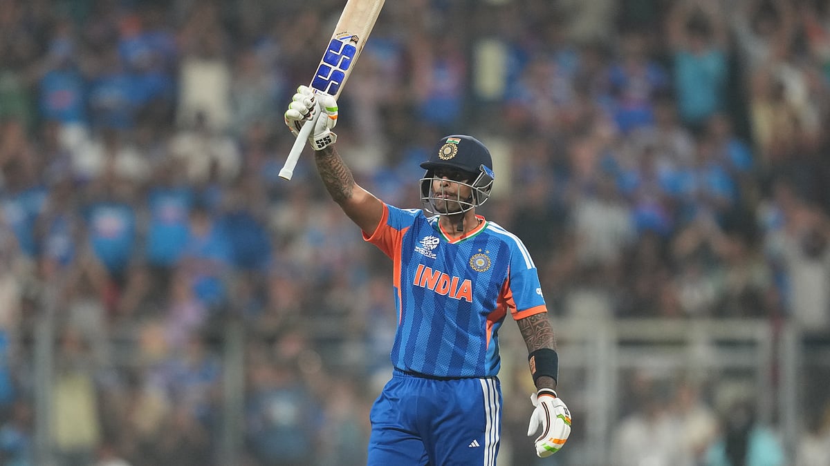 (AP Photo/Rafiq Maqbool) : India's captain Suryakumar Yadav celebrates his fifty runs during the T20 World Cup cricket match between India and the United States in Mumbai, India, Saturday, Feb. 7, 2026