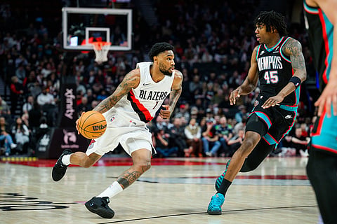 Portland Trail Blazers guard Blake Wesley (1) drives past Memphis Grizzlies forward GG Jackson II (45) in the second half of an NBA basketball game in Portland, Oregon.