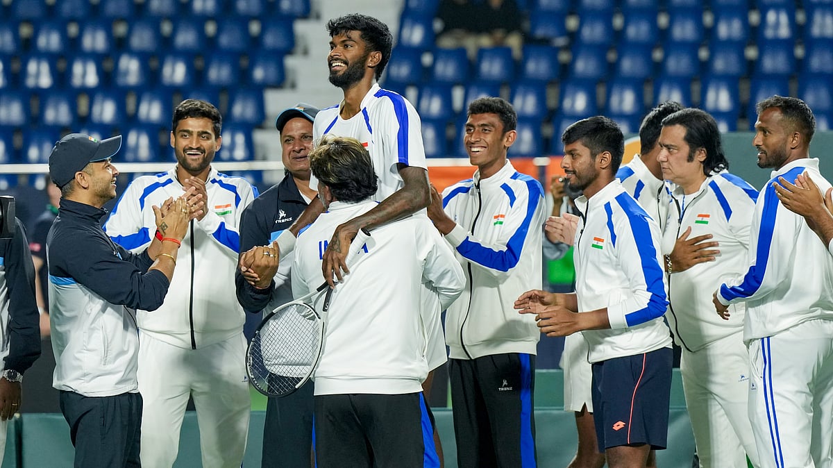 PTI : Dhakshineswar Suresh with captain of the Indian Davis Cup team Rohit Rajpal, second from right, and others celebrates his victory in the second singles match of the 2026 Davis Cup Qualifiers first-round tie against Netherlands' Jesper De Jong, unseen, at SM Krishna Tennis Stadium, in Bengaluru.