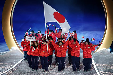 Athletes from Japan walk during the Olympic opening ceremony at the 2026 Winter Olympics, in Livigno, Italy.