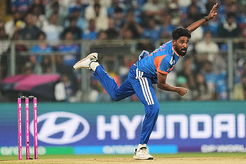 India's Mohammed Siraj bowls a delivery during the T20 World Cup cricket match between India and the United States in Mumbai.