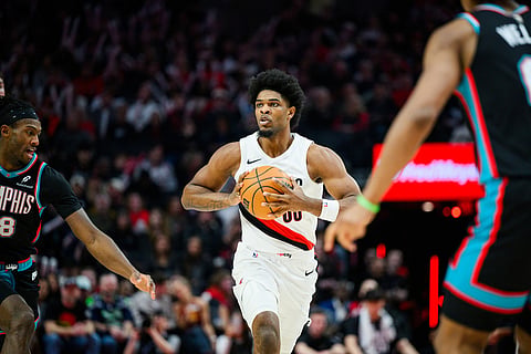 Portland Trail Blazers guard Scoot Henderson (00) looks for an open teammate in the second half of an NBA basketball game against the Memphis Grizzlies in Portland, Oregon. 