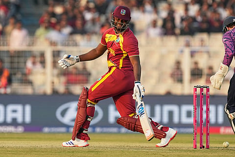 West Indies' Romario Shepherd reacts after missing his shot during the T20 World Cup cricket match between Scotland and West Indies in Kolkata.
