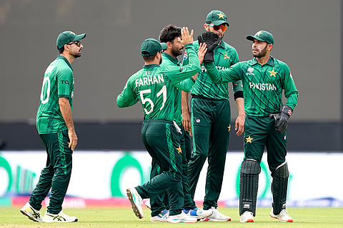 Pakistan's Usman Khan, right, celebrates with teammates after taking the catch to dismiss Netherlands' Max O'Dowd during the T20 World Cup cricket match between Netherlands and Pakistan in Colombo, Sri Lanka.