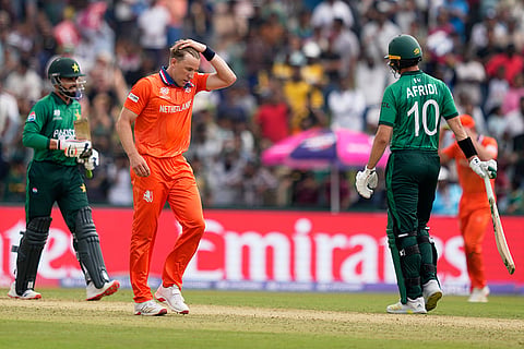 Netherlands' Logan van Beek, center, reacts after getting hit for a six by Pakistan's Faheem Ashraf, left, during the T20 World Cup cricket match between Netherlands and Pakistan in Colombo, Sri Lanka.