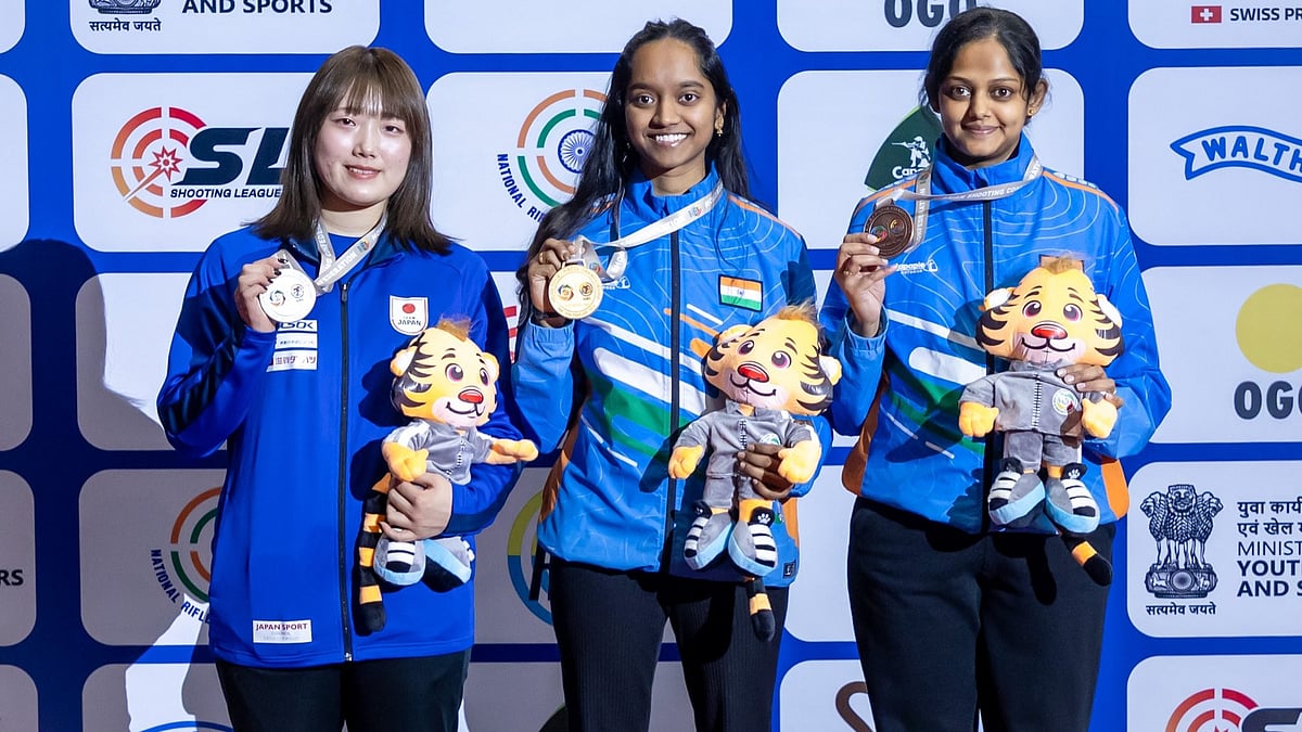 X/NRAI : India's Meghana Sajjanar (right) and Elavenil Valarivan (centre) on the podium after bagging bronze and gold medals at the Asian Championship 2026's women’s 10m air rifle event.