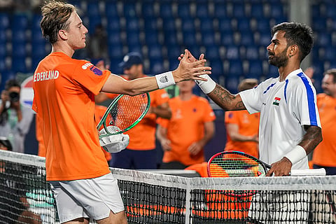Netherlands' Guy Den Ouden, left, exchanges greetings with India's Sumit Nagal after the former's victory in the 2026 Davis Cup Qualifiers first round tie, at SM Krishna Tennis Stadium, in Bengaluru, Karnataka.