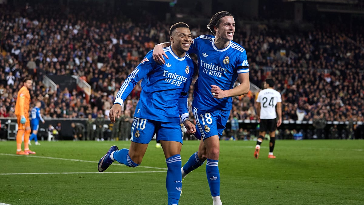 Kylian Mbappe and Alvaro Carreras celebrate.