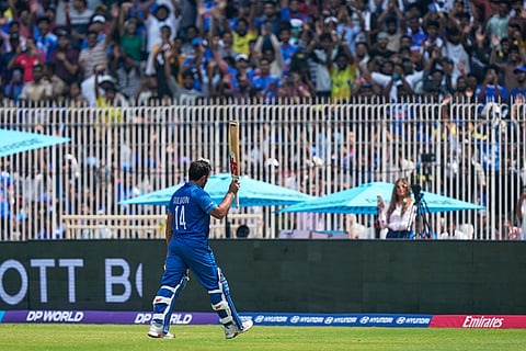 Afghanistan's Gulbadin Naib acknowledges the crowd as he leaves the ground after losing his wicket during the T20 World Cup cricket match between Afghanistan and New Zealand in Chennai, India.