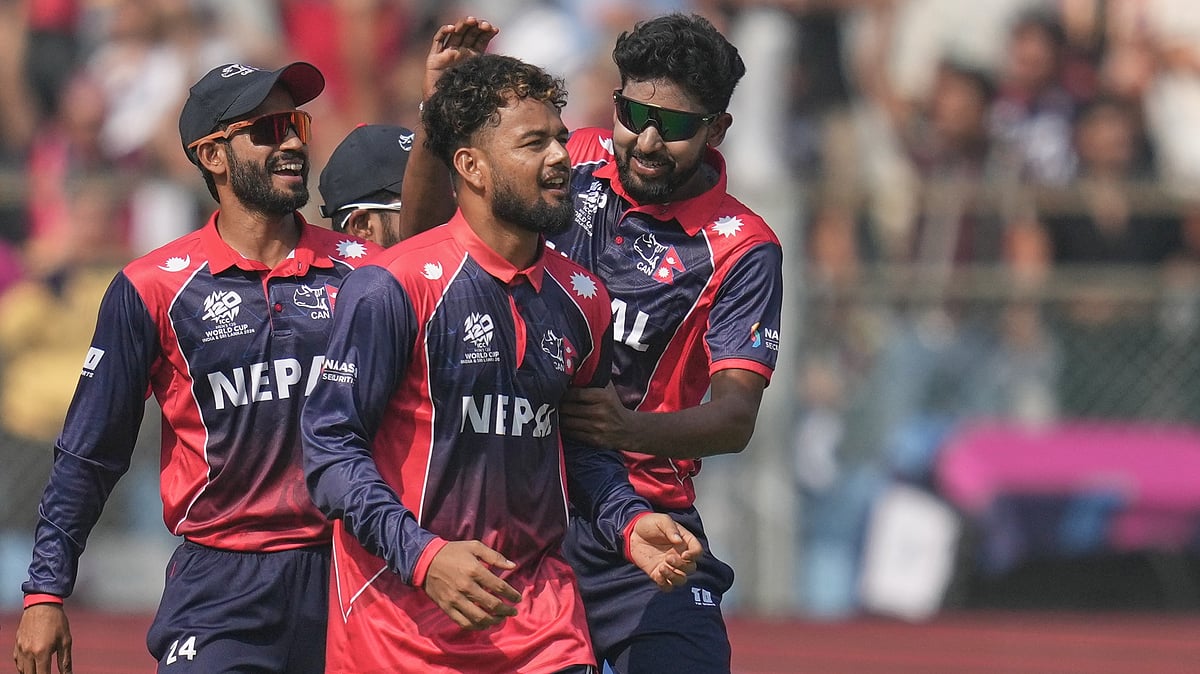 (AP Photo/Rafiq Maqbool) : Nepal's Sher Malla, second left, celebrates with teammates the wicket of England's Phil Salt during the T20 World Cup cricket match between England and Nepal in Mumbai, India, Sunday,Feb. 8, 2026