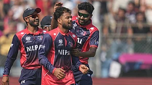 (AP Photo/Rafiq Maqbool) : Nepal's Sher Malla, second left, celebrates with teammates the wicket of England's Phil Salt during the T20 World Cup cricket match between England and Nepal in Mumbai, India, Sunday,Feb. 8, 2026