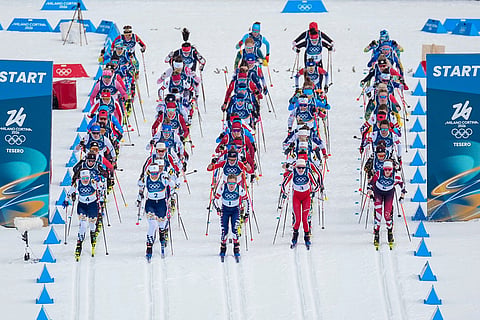 Jessie Diggins of the United States, center, and others start in the cross country skiing women's 10km + 10km skiathlon at the 2026 Winter Olympics, in Tesero, Italy.