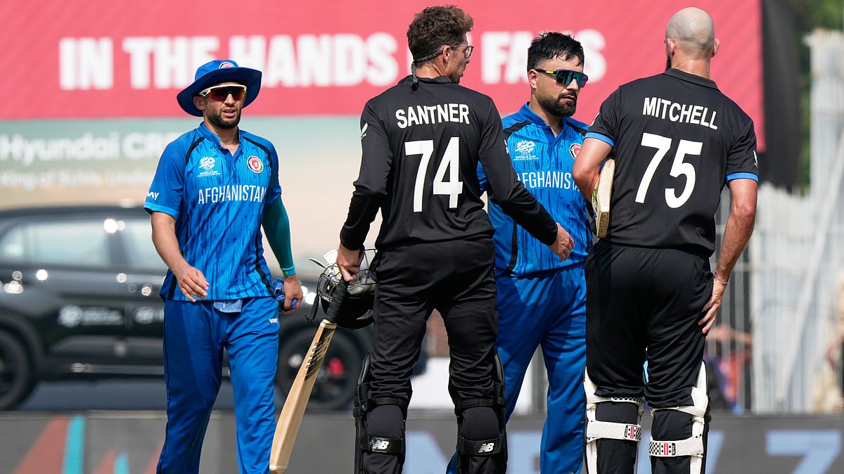 (AP Photo/Mahesh Kumar A.) : Afghanistan's captain Rashid Khan, center, greets New Zealand's Daryl Mitchell, right, and Mitchel Santner after New Zealand won their T20 World Cup cricket match against Afghanistan in Chennai, India, Sunday, Feb. 8, 2026