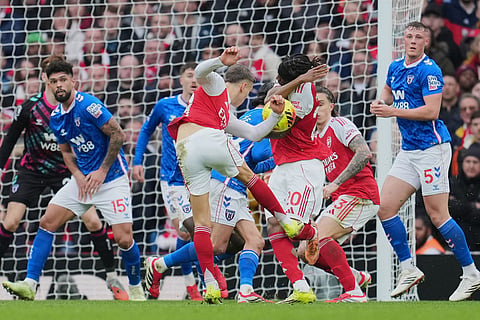 Arsenal's Leandro Trossard shoots during the English Premier League soccer match between Arsenal and Sunderland in London, England.