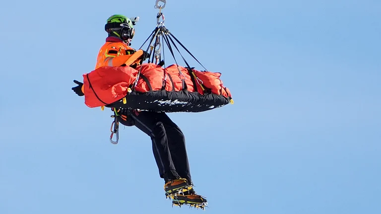 United States' Lindsey Vonn is airlifted away after a crash during an alpine ski women's downhill race, at the 2026 Winter Olympics, in Cortina d'Ampezzo, Italy, Sunday, Feb. 8, 2026. - (AP Photo/Jacquelyn Martin)