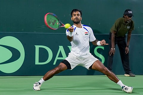 India's Sumit Nagal competes against Netherlands' Guy Den Ouden, unseen, during the first singles match of the 2026 Davis Cup Qualifiers first round tie, at SM Krishna Tennis Stadium, in Bengaluru, Karnataka.