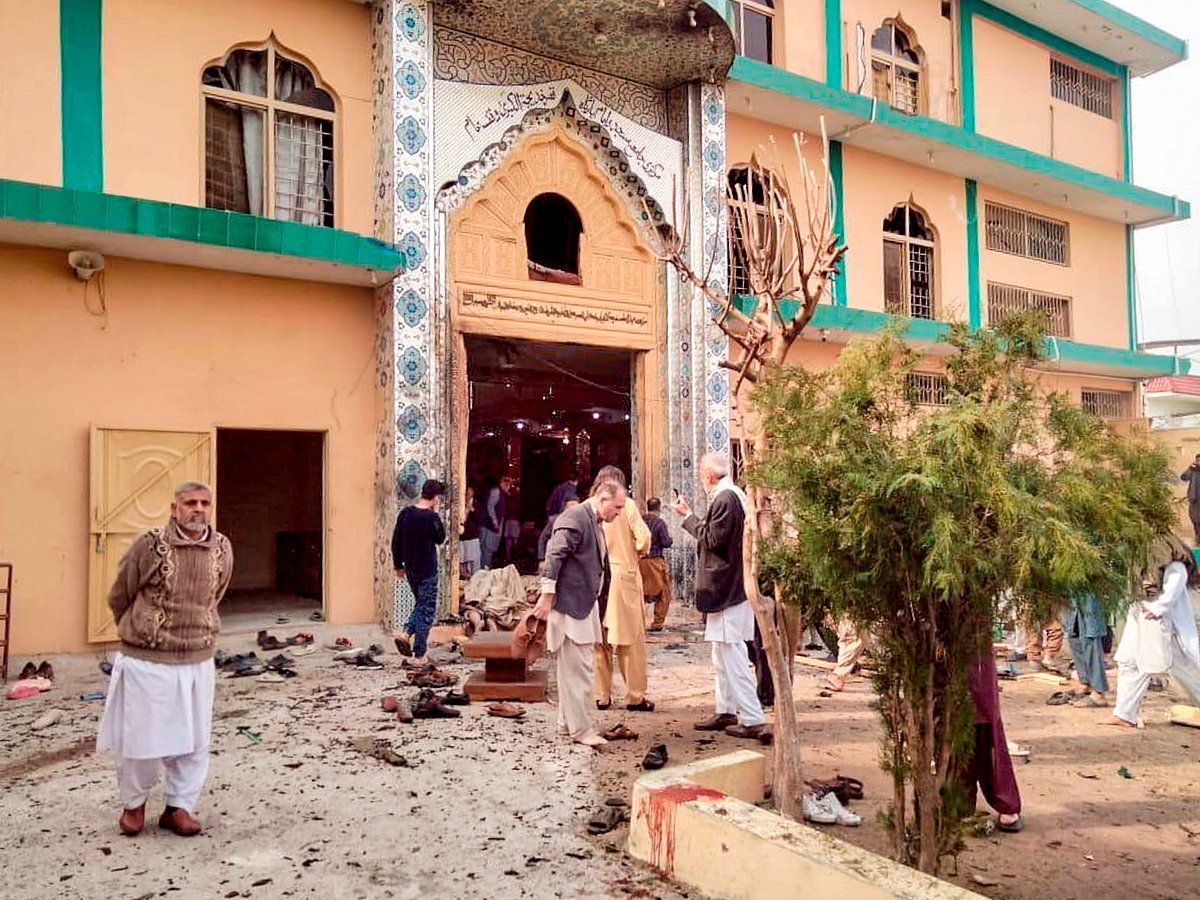 PTI : Locals gather at the site after a suicide bomber blew himself up at a mosque during Friday prayers, in Islamabad, Pakistan, Friday, Feb. 6, 2026. 