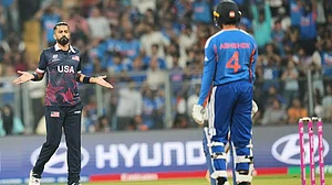 | Photo: AP/Rafiq Maqbool : United States' Ali Khan, left, celebrates the wicket of India's Abhishek Sharma, right, during the T20 World Cup cricket match between India and the United States in Mumbai.