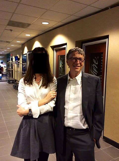 BILL GATES with an unknown person whose face is redacted. 