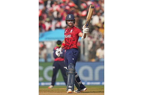 England's Jacob Bethell celebrates his fifty runs during the T20 World Cup cricket match between England and Nepal in Mumbai, India.