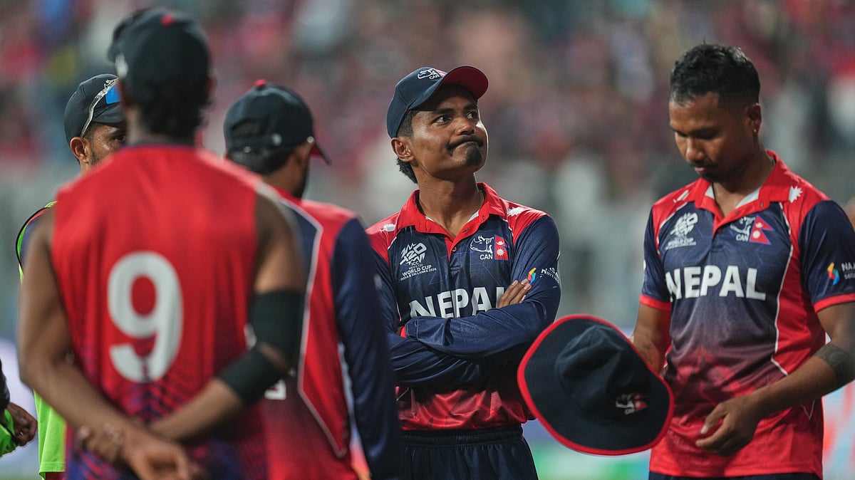 (AP Photo/Rafiq Maqbool) : Nepal's captain Rohit Paudel, center, reacts after losing the match against England during the T20 World Cup cricket in Mumbai, India, Sunday,Feb. 8, 2026