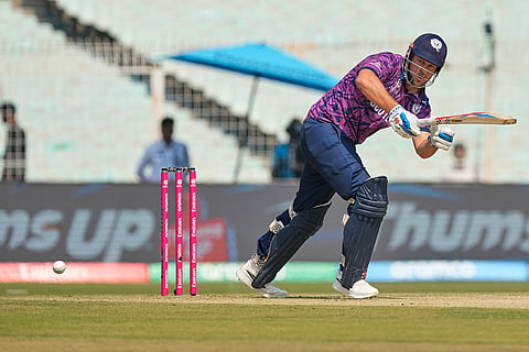 Scotland's George Munsey plays a shot during the T20 World Cup cricket match between Italy and Scotland in Kolkata.