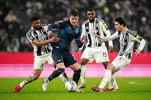 Lazio's Daniel Maldini, second left, fights for the ball with Juventus' Bremer, left, during the Serie A soccer match between Juventus and Lazio, in Turin, Italy.