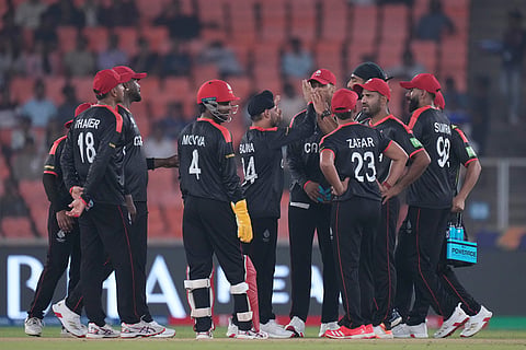 Canada players celebrate the wicket of South Africa's Quinton de Kock during the T20 World Cup cricket match between Canada and South Africa in Ahmedabad.