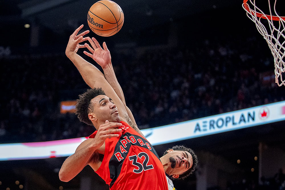 | Photo: Frank Gunn/The Canadian Press via AP : Toronto Raptors forward Trayce Jackson-Davis (32) is fouled by Indiana Pacers guard Ben Sheppard, right, as he goes in for a dunk during second-half NBA basketball game action in Toronto.