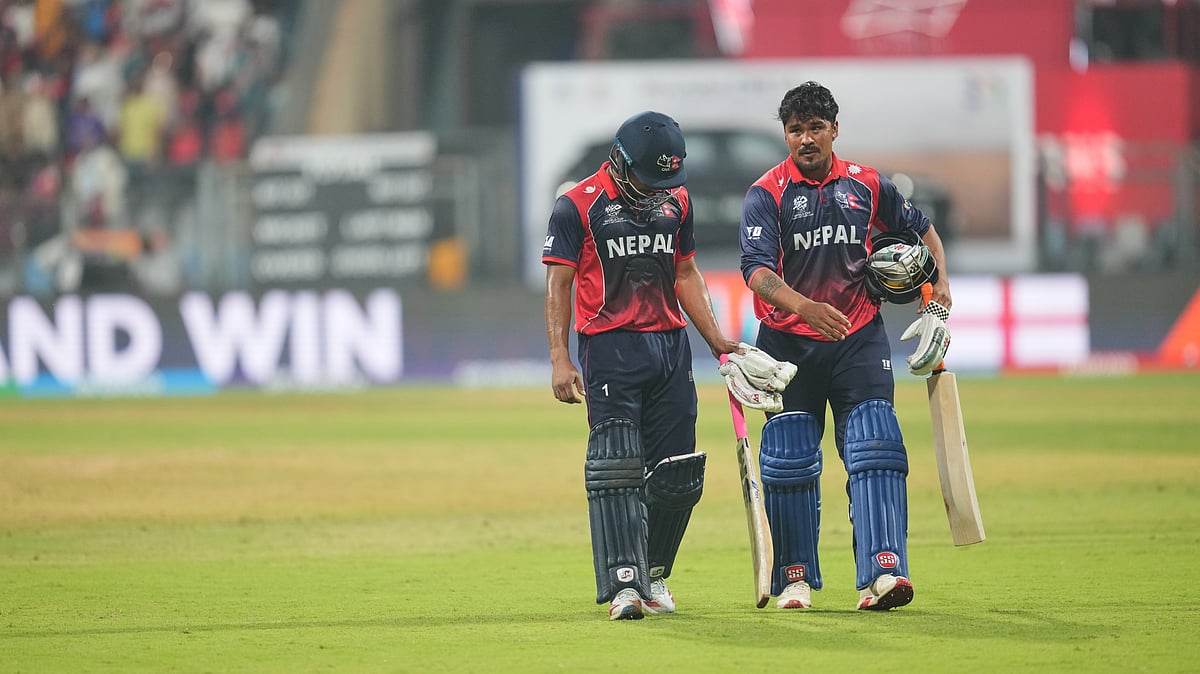 | Photo: AP/Rafiq Maqbool : Nepal's Lokesh Bam with batting partner Karan KC walk back to pavilion after losing against England during the T20 World Cup cricket match in Mumbai, India, Sunday,Feb. 8, 2026.