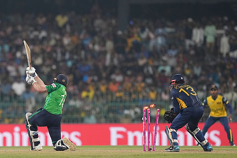 Ireland's Ross Adair, left, bowled out by Sri Lanka's Wanindu Hasaranga during the T20 World Cup cricket match between Sri Lanka and Ireland in Colombo, Sri Lanka.